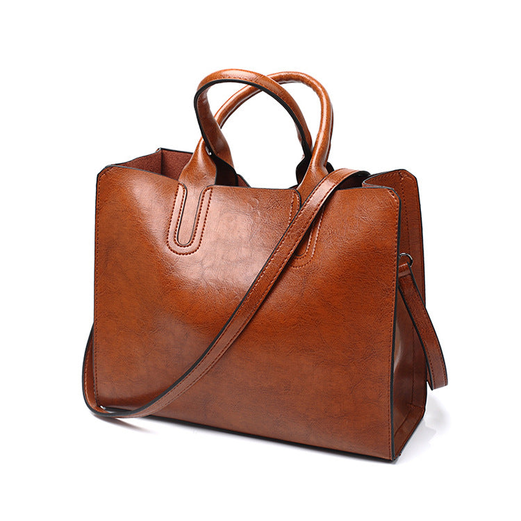 A drop-shipping women's bag 2023 new retro oil wax leather fashion tote bag simple portable one-shoulder cross-body women's bag