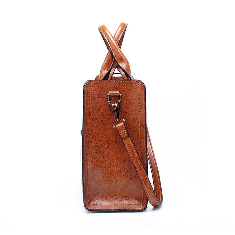 A drop-shipping women's bag 2023 new retro oil wax leather fashion tote bag simple portable one-shoulder cross-body women's bag