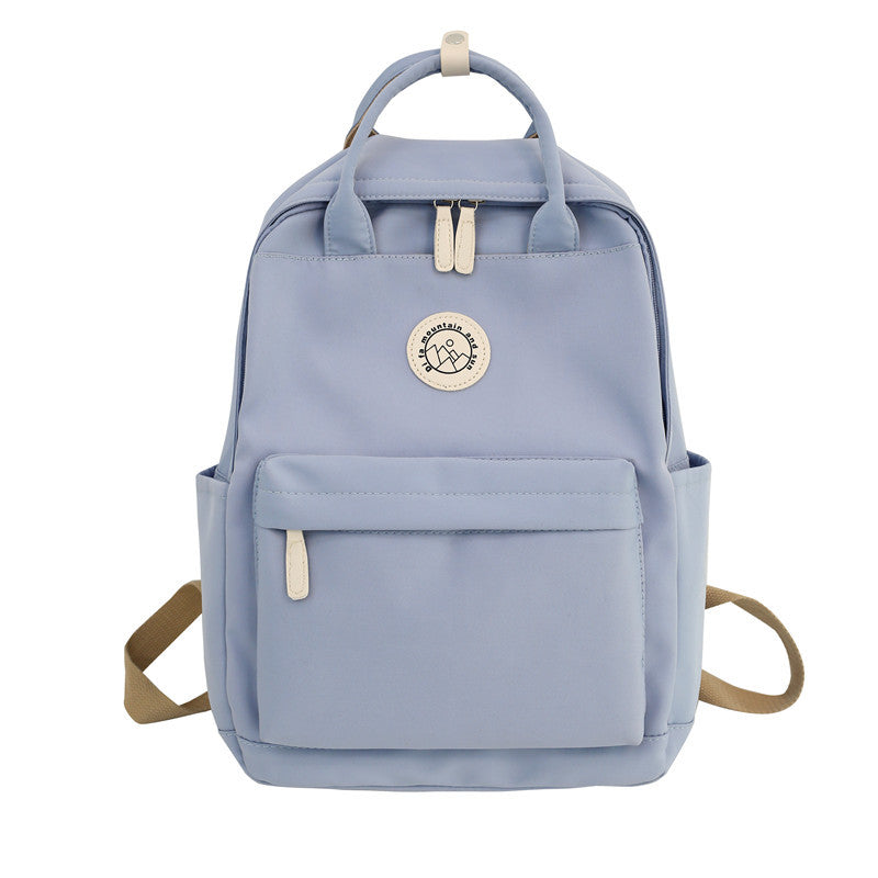 Japanese ins school bag for female middle school students 2023 new simple solid color large capacity backpack female travel backpack