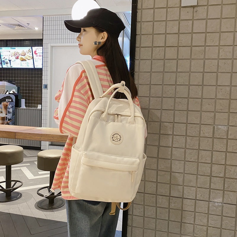 Japanese ins school bag for female middle school students 2023 new simple solid color large capacity backpack female travel backpack