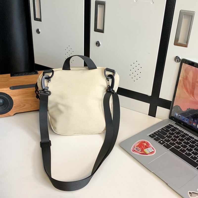 Wholesale trendy brand workwear couple crossbody bag casual sports Japanese student small shoulder bag lightweight sports bucket bag