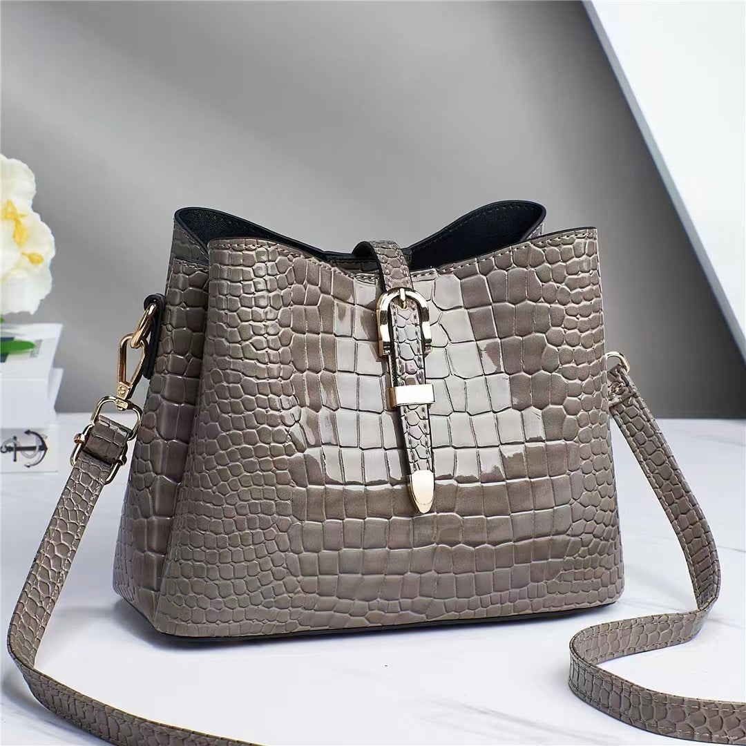 Factory bag 2022 new women's bag European and American cross-border trend texture bright leather stone pattern one-shoulder cross-body bucket bag