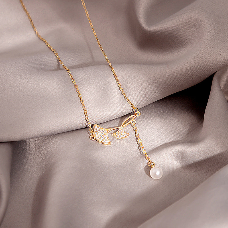 Douyin Explosive Titanium Steel Necklace Light Luxury Micro-inlaid Longevity Lock Maple Leaf Jade Gourd Turnable Windmill Pendant Clavicle Chain
