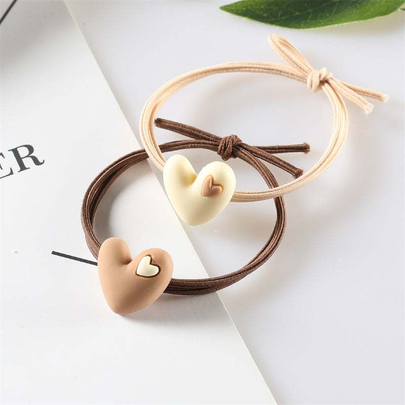 Korean version of popular peach heart milk tea color head rope female hair rope tie hair adult student hair ring heart-shaped rubber band headdress