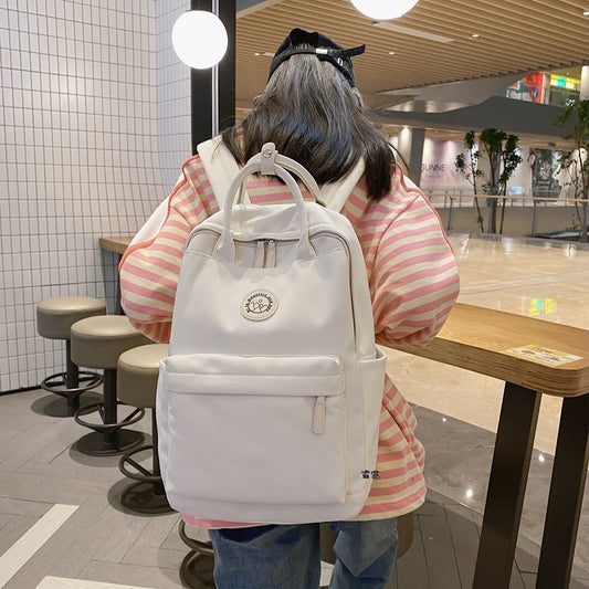 Japanese ins school bag for female middle school students 2023 new simple solid color large capacity backpack female travel backpack 