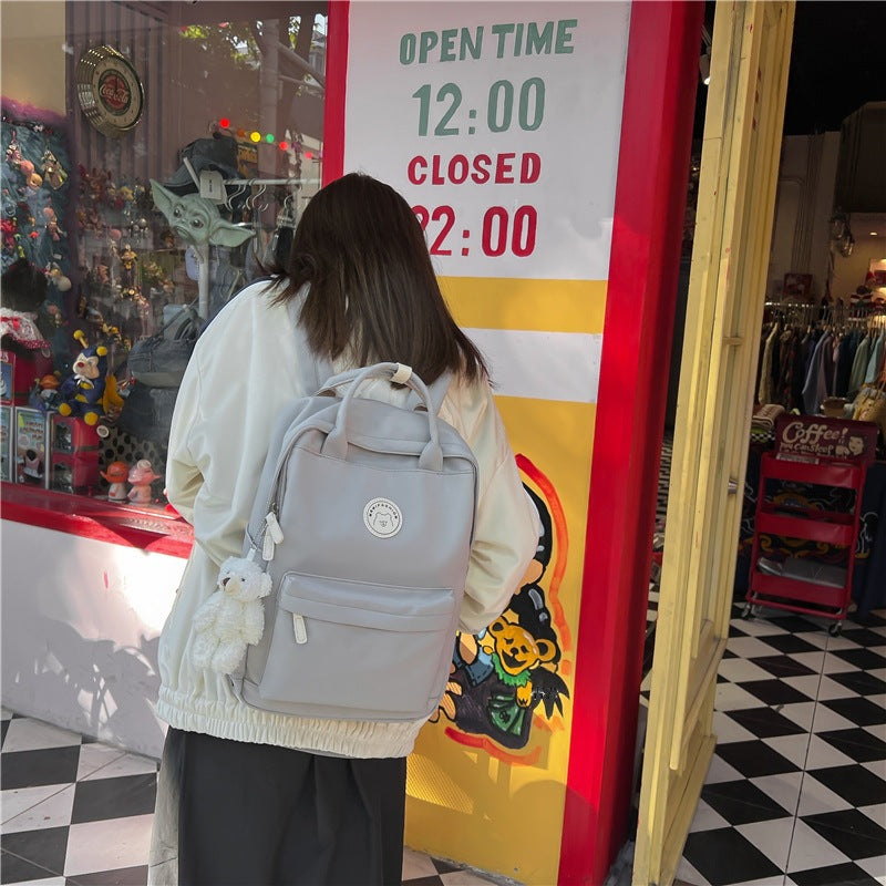 Japanese ins girl backpack Korean version junior high school student school bag female trendy large capacity solid color nylon handbag 