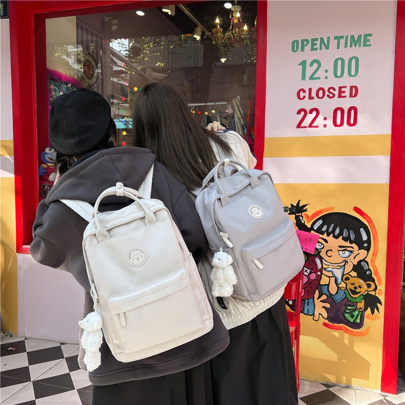 Japanese ins girl backpack Korean version junior high school student school bag female trendy large capacity solid color nylon handbag 