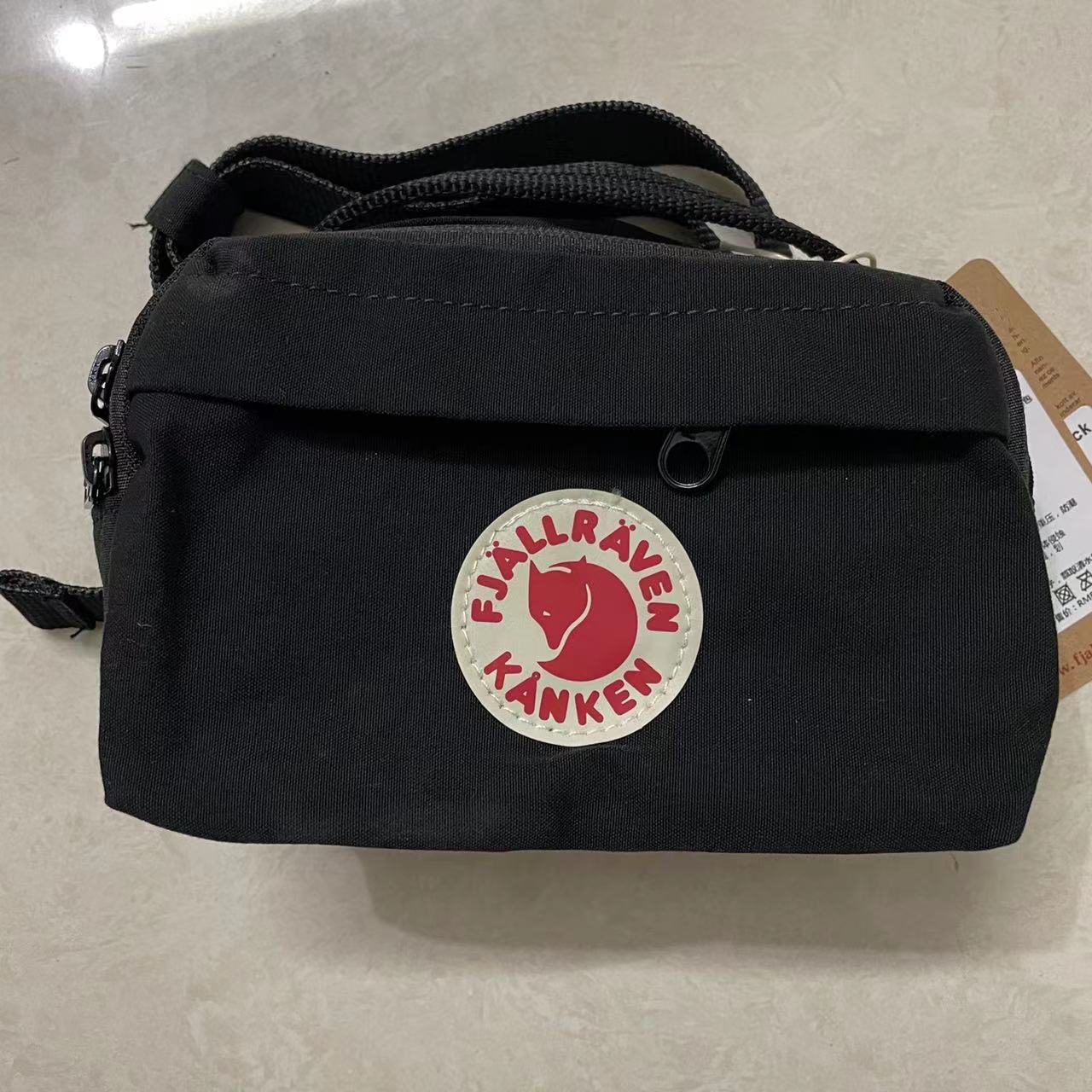 စက်ရုံမှတိုက်ရိုက်ရောင်းချခြင်းနှင့် dropshipping Fox အနောက်မြောက်အာတိတ်အားကစားခါးပတ်အိတ်နိုင်ငံခြားကုန်သွယ်မှုရင်ဘတ်အိတ် Canvas ခရီးသွားလက်ကိုင်အိတ် 