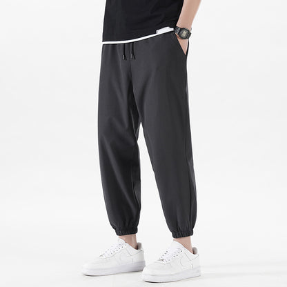 Enbu summer new men's Korean version loose ice silk thin section solid color casual sports nine-point pants trendy couple pants 