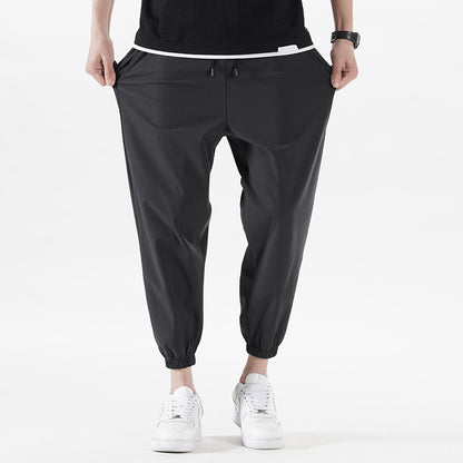 Enbu summer new men's Korean version loose ice silk thin section solid color casual sports nine-point pants trendy couple pants 