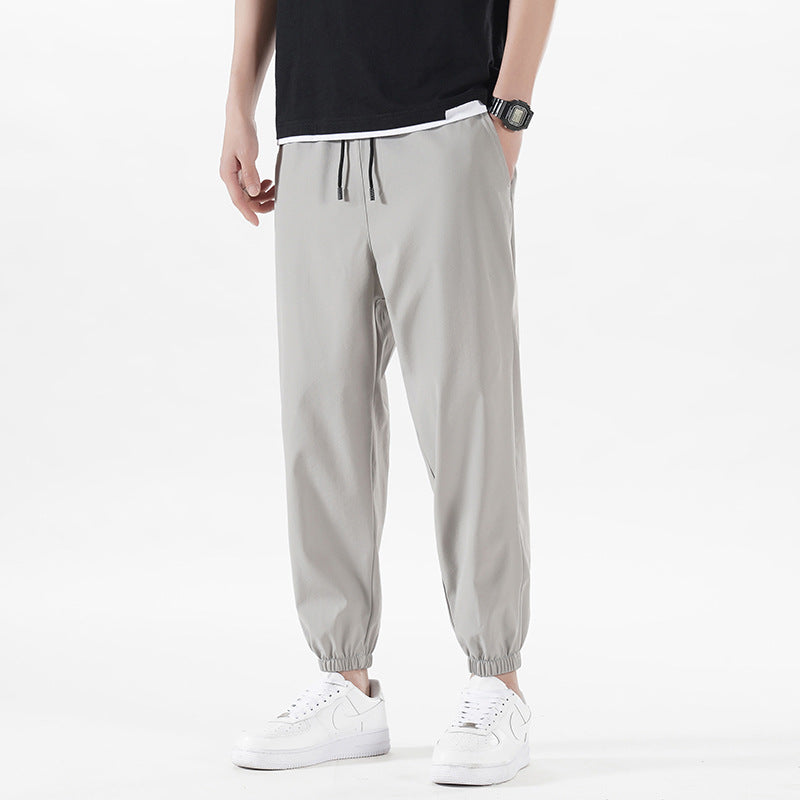 Enbu summer new men's Korean version loose ice silk thin section solid color casual sports nine-point pants trendy couple pants 